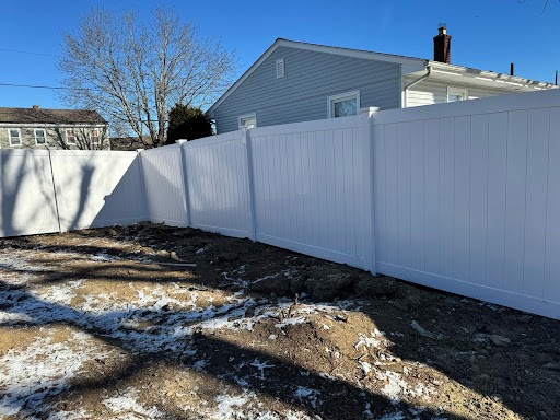 White vinyl privacy fence installation