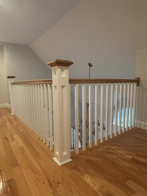 Custom staircase railing with oak cap